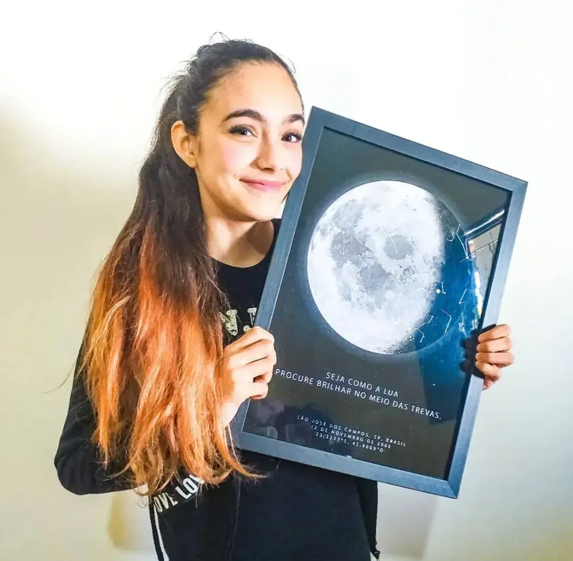 Girl holding star map from her birth, special gift from momRetry